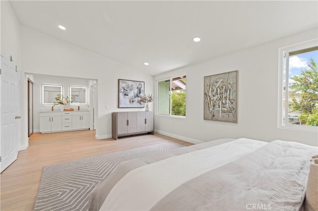 49 W Yale Loop Unit 26, Irvine, CA 92604 - bedroom with light wood-style flooring, multiple windows, vaulted ceiling, recessed lighting, and baseboards