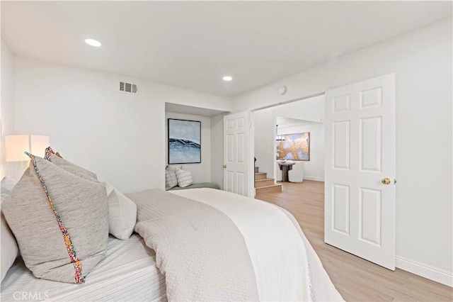 49 W Yale Loop Unit 26, Irvine, CA 92604 - bedroom featuring light wood-type flooring, recessed lighting, and baseboards
