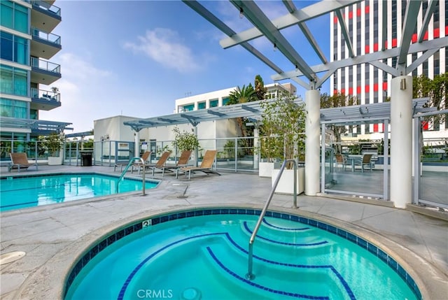 pool with a pergola and a patio area