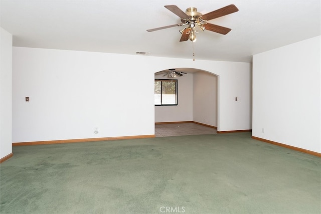 50566 Critter Creek Ln, Oakhurst, CA 93644 - empty room with a ceiling fan, carpet floors, arched walkways, and baseboards