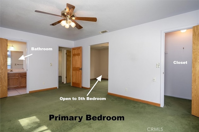 50566 Critter Creek Ln, Oakhurst, CA 93644 - unfurnished bedroom featuring a spacious closet, carpet, baseboards, ensuite bathroom, and a ceiling fan