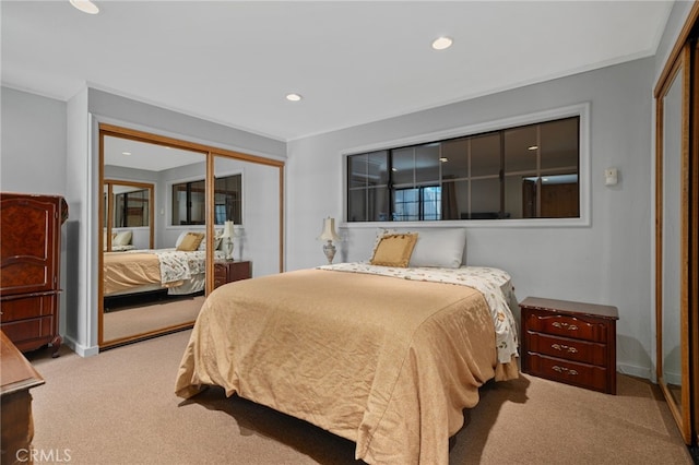 carpeted bedroom featuring recessed lighting, a closet, and baseboards