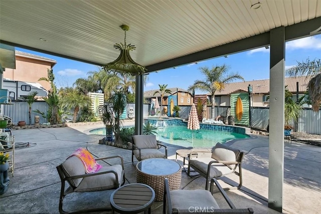 view of patio / terrace with a fenced backyard, a fenced in pool, and a residential view