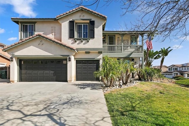 mediterranean / spanish-style house with a garage, a tile roof, a balcony, stucco siding, and driveway
