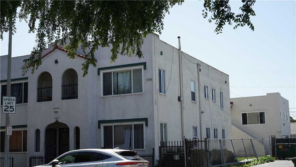 view of property with fence