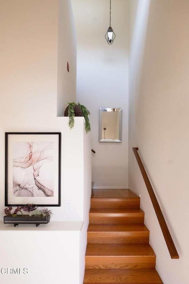 stairs with wood finished floors