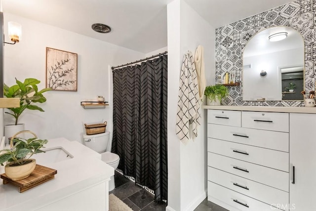 bathroom featuring vanity, a shower with curtain, and toilet
