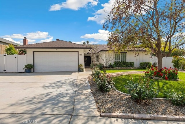 single story home featuring a gate, an attached garage, driveway, and stucco siding
