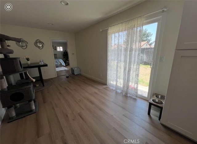 2145 Grand Ave, San Bernardino, CA 92407 - living area featuring light wood finished floors and baseboards
