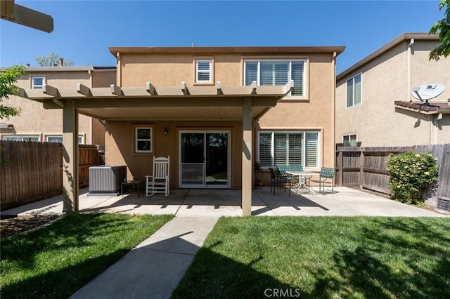 4214 Berryesa Ave, Merced, CA 95348 - rear view of property featuring a yard, a patio, stucco siding, and fence