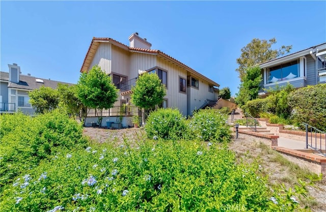 10 Mela Ln, Rancho Palos Verdes, CA 90275 - view of side of property featuring a chimney and a tiled roof