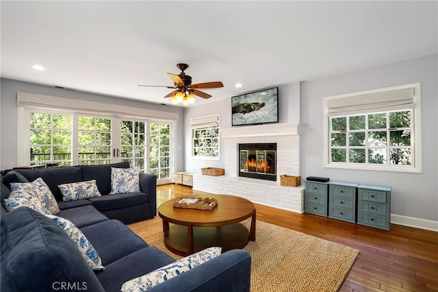 335 Sycamore Gln, Pasadena, CA 91105 - living room with a ceiling fan, a wealth of natural light, a fireplace, and wood-type flooring