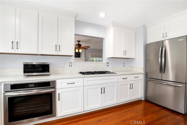 335 Sycamore Gln, Pasadena, CA 91105 - kitchen featuring stainless steel appliances, white cabinets, dark wood-type flooring, ceiling fan, and light countertops