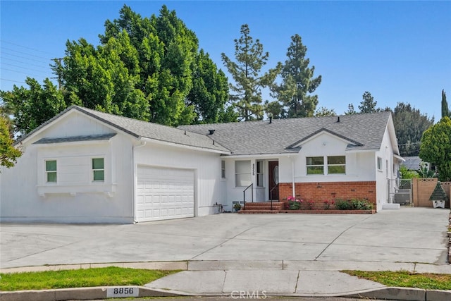 8856 Fullbright Ave, Winnetka, CA 91306 - single story home featuring an attached garage, brick siding, a gate, and concrete driveway