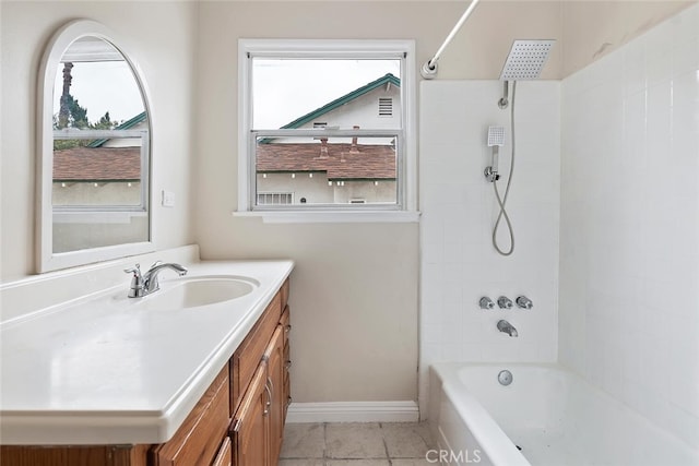 8856 Fullbright Ave, Winnetka, CA 91306 - bathroom featuring baseboards, vanity, tile patterned floors, and shower / tub combination