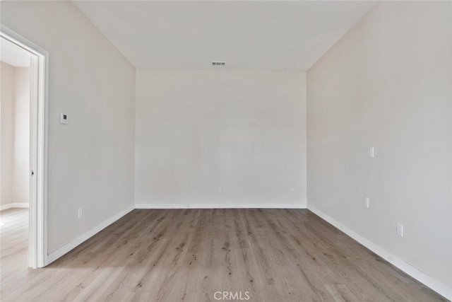 8856 Fullbright Ave, Winnetka, CA 91306 - unfurnished room with baseboards, wood finished floors, and visible vents