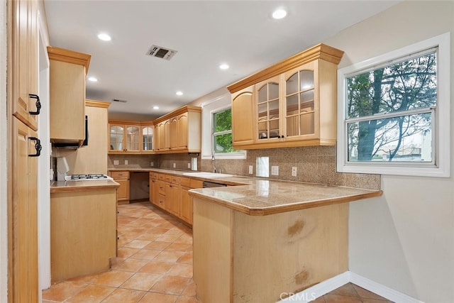8856 Fullbright Ave, Winnetka, CA 91306 - kitchen featuring light brown cabinets, a peninsula, a sink, and visible vents