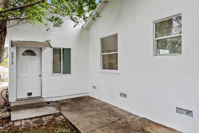 8856 Fullbright Ave, Winnetka, CA 91306 - doorway to property featuring a patio area, crawl space, and stucco siding