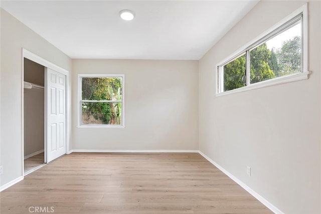 8856 Fullbright Ave, Winnetka, CA 91306 - unfurnished bedroom with light wood-style flooring, baseboards, and a closet