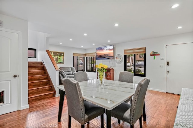 dining area with stairway, recessed lighting, baseboards, and light wood-type flooring