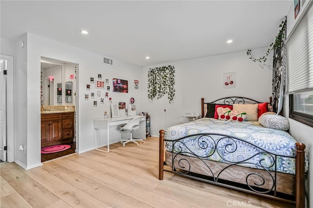 bedroom featuring recessed lighting, light wood finished floors, visible vents, and multiple windows