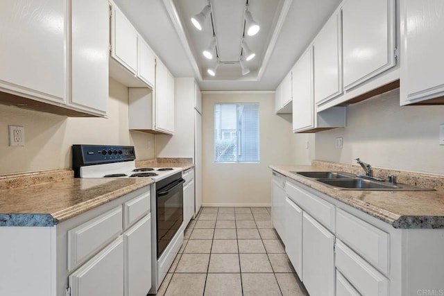 6560 College Grove Dr Unit 79, San Diego, CA 92115 - kitchen featuring a sink, range with electric cooktop, white cabinetry, light tile patterned floors, and a tray ceiling