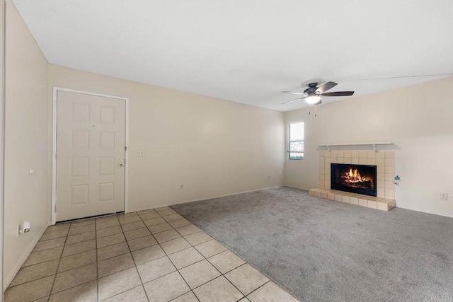 6560 College Grove Dr Unit 79, San Diego, CA 92115 - unfurnished living room featuring ceiling fan, light carpet, light tile patterned floors, and a fireplace