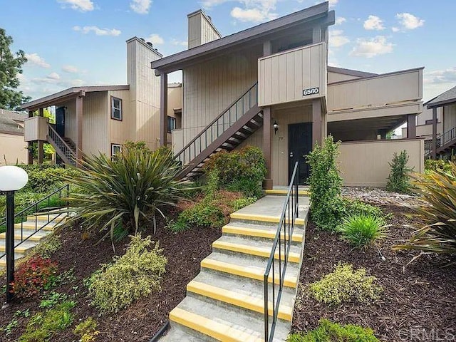 6560 College Grove Dr Unit 79, San Diego, CA 92115 - view of front of property with a chimney and stairs