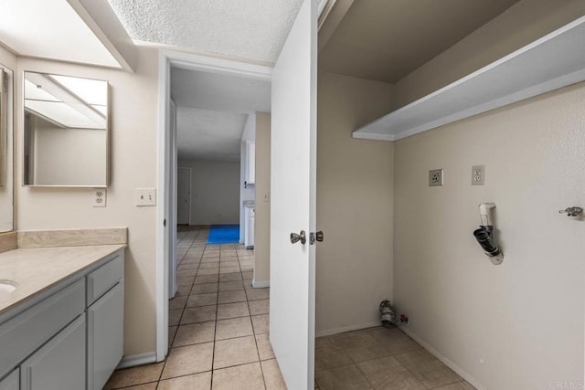 6560 College Grove Dr Unit 79, San Diego, CA 92115 - washroom with baseboards and light tile patterned floors