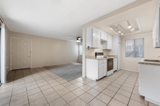 6560 College Grove Dr Unit 79, San Diego, CA 92115 - kitchen featuring electric range, light tile patterned flooring, a ceiling fan, open floor plan, and a tray ceiling
