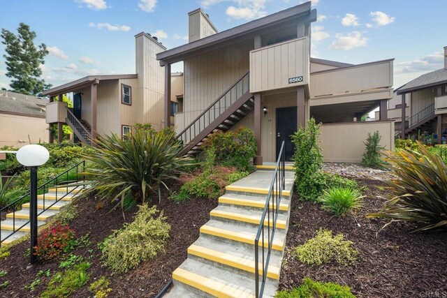 6560 College Grove Dr Unit 79, San Diego, CA 92115 - view of front of property with stairs and a chimney