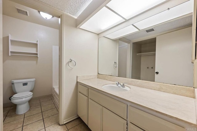 6560 College Grove Dr Unit 79, San Diego, CA 92115 - full bath with visible vents, tile patterned floors, a bathing tub, vanity, and toilet