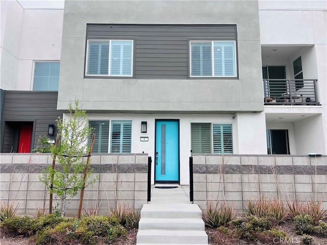 3641 S Allston Paseo Unit 9, Ontario, CA 91761 - view of front of house with fence and stucco siding
