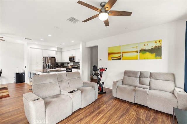 45477 Calle Cirros, Temecula, CA 92592 - living area featuring a ceiling fan, wood finished floors, and recessed lighting