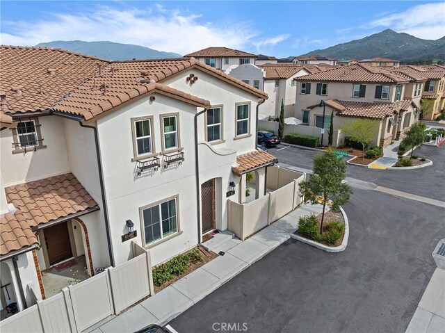 45477 Calle Cirros, Temecula, CA 92592 - view of front facade featuring a mountain view, a tile roof, and stucco siding