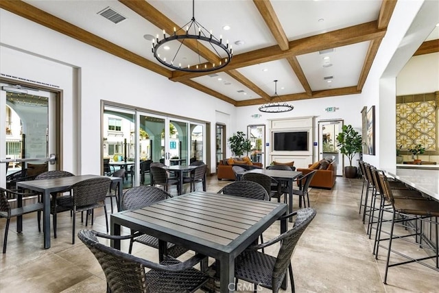 45477 Calle Cirros, Temecula, CA 92592 - dining area with plenty of natural light, a chandelier, beamed ceiling, concrete flooring, and coffered ceiling