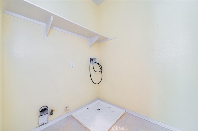 laundry room featuring hookup for a gas dryer, hookup for a washing machine, baseboards, and laundry area