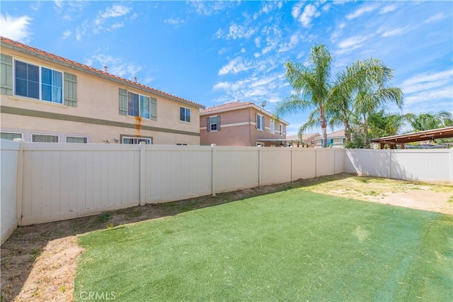 view of yard featuring a fenced backyard