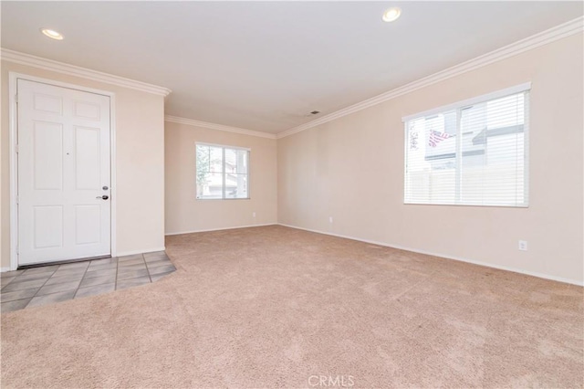 carpeted spare room featuring baseboards, recessed lighting, and crown molding