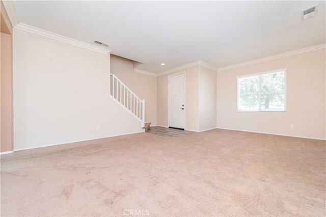 unfurnished living room with carpet flooring, visible vents, stairs, and ornamental molding
