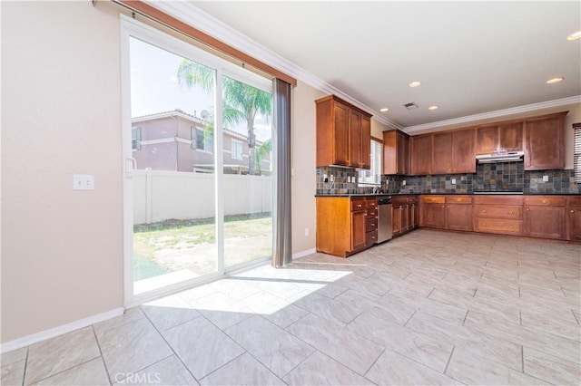 kitchen featuring backsplash, dark countertops, ornamental molding, and under cabinet range hood