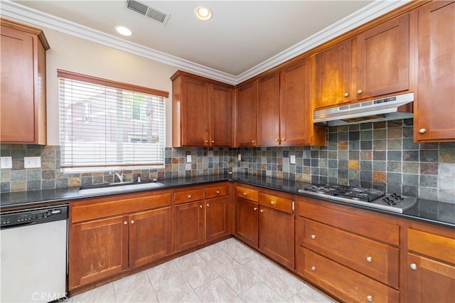 kitchen featuring a sink, visible vents, crown molding, dishwasher, and under cabinet range hood