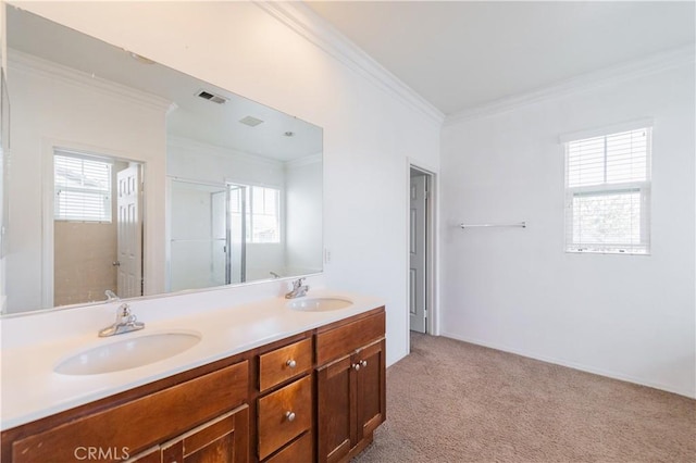bathroom featuring double vanity, visible vents, a sink, and ornamental molding