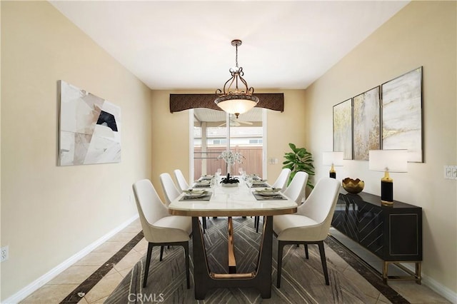 dining area featuring baseboards and light tile patterned flooring