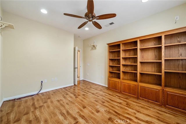 interior space with a ceiling fan, baseboards, recessed lighting, wood finished floors, and visible vents