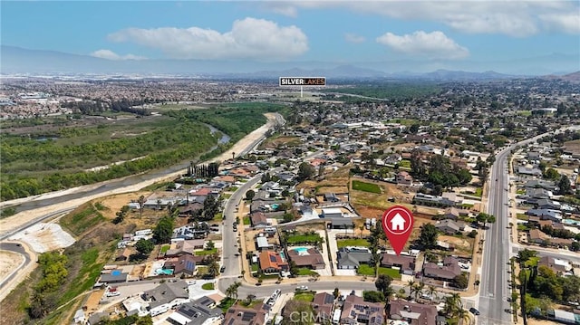 birds eye view of property with a mountain view and a residential view