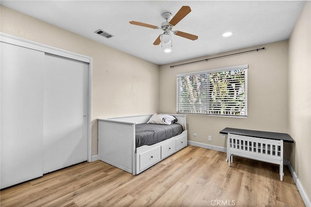 bedroom featuring wood finished floors, baseboards, visible vents, and recessed lighting
