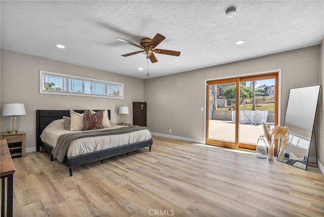bedroom with recessed lighting, access to outside, and light wood-style flooring