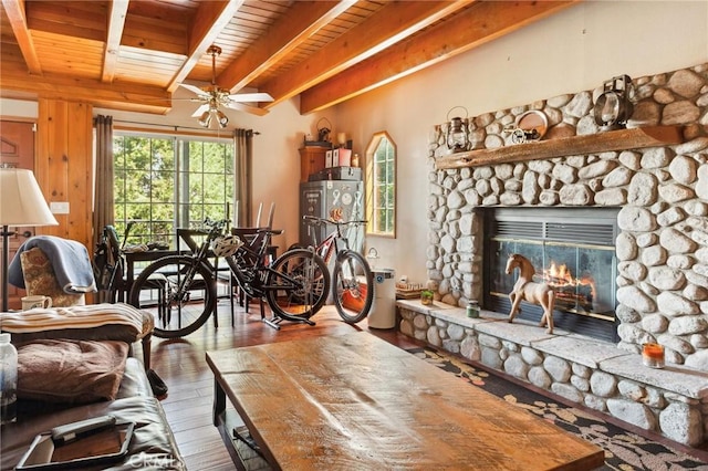 living area with beam ceiling, a ceiling fan, wooden ceiling, and hardwood / wood-style flooring