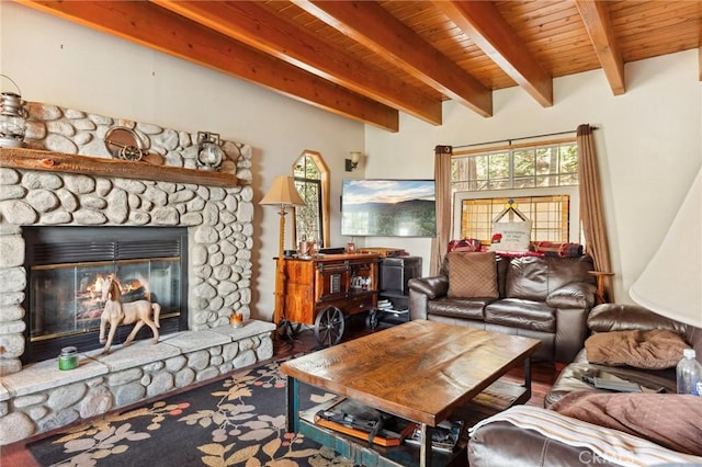 living area with a fireplace, wooden ceiling, and beam ceiling